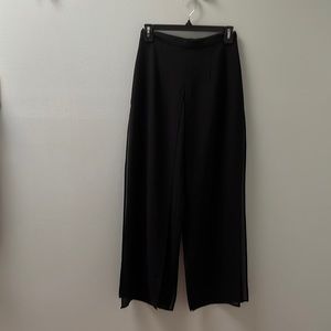 Black dress pants with chiffon overlay.